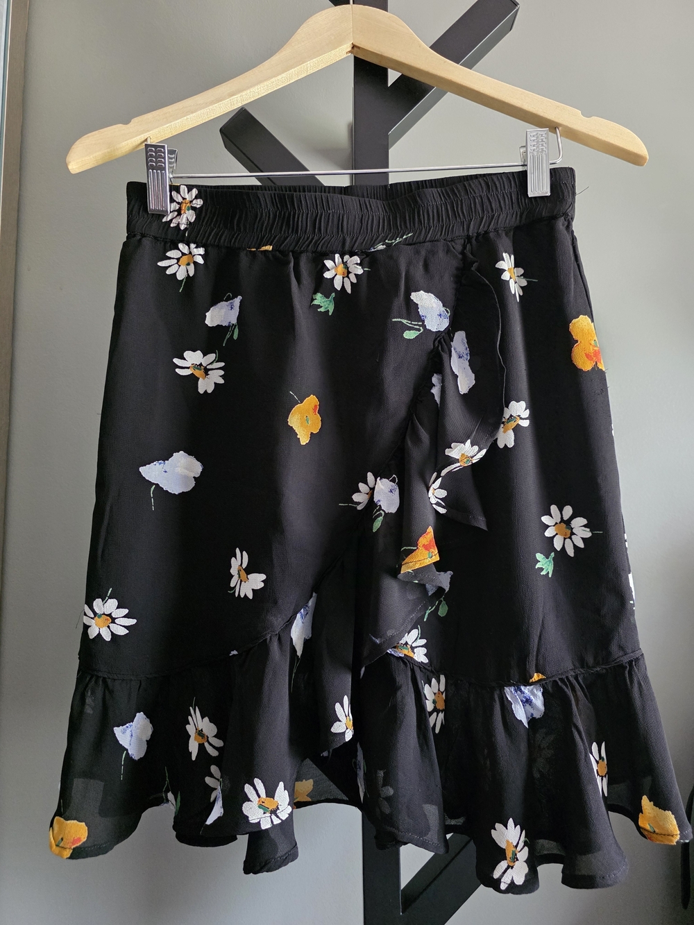 Authentic GANNI Dainty Georgette Mini Skirt in a black daisy print.